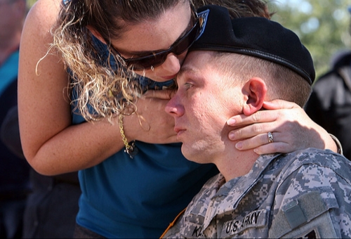 woman kissing young war vet
